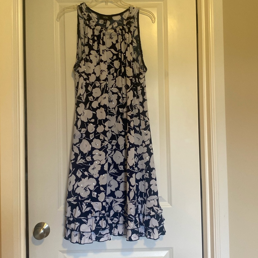 MSK sleeveless dress with ruffled hemline.